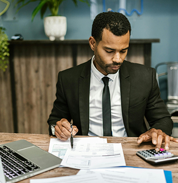 man in suit at desk