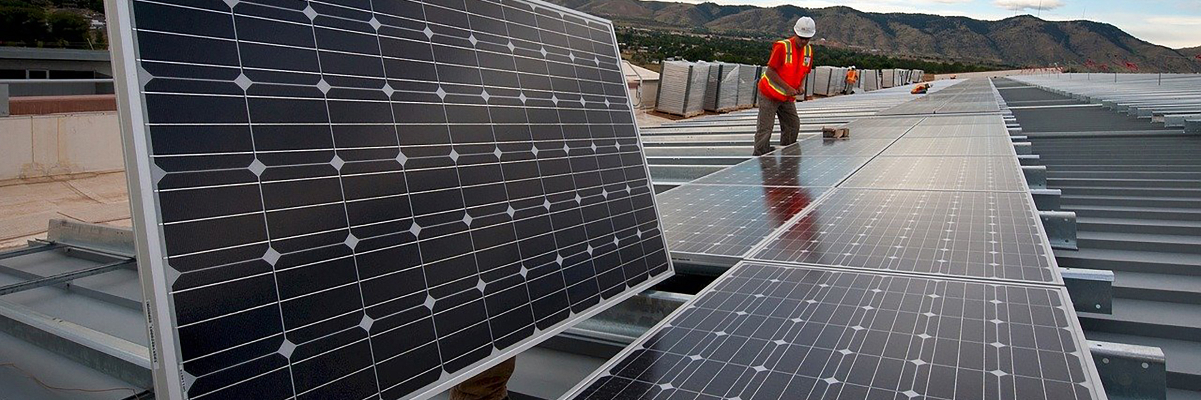 worker with solar panels