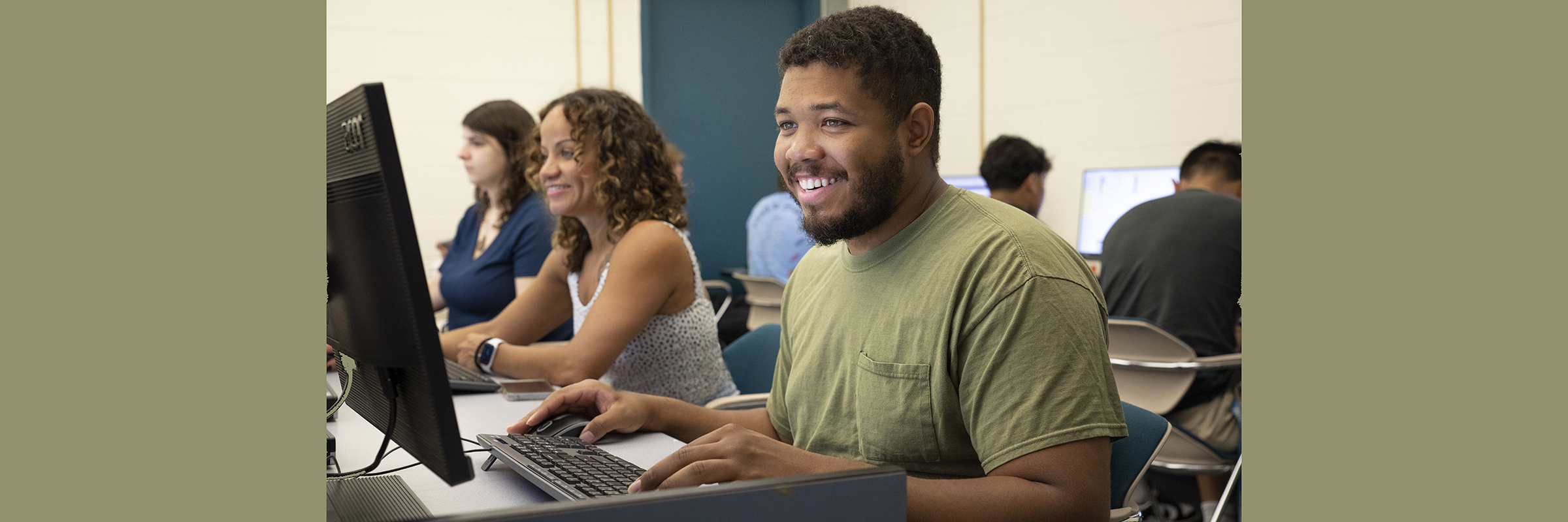 happy young black man at computer
